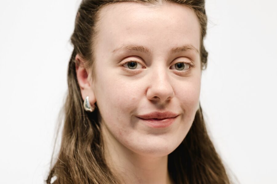 Phoebe facing the camera against a white background