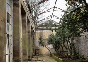 An outside garden terrace, derelict and roofless.