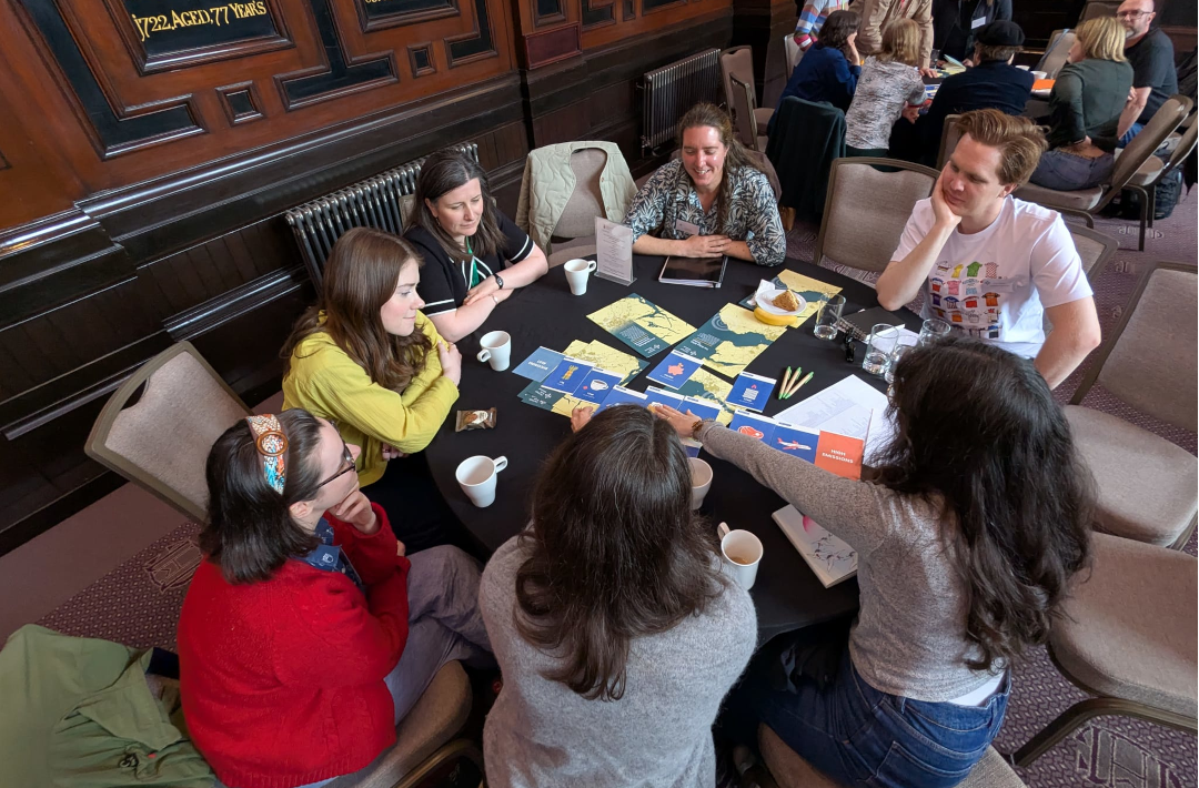 A group of people gathered around a conference table