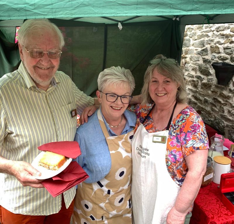 Photograph of three people stood smiling at the Nantgarw China Works' summer open day.