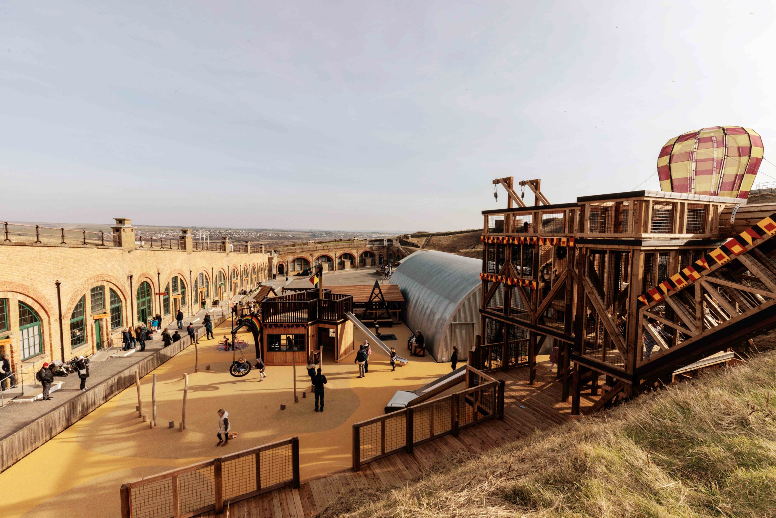 Photograph of Newhaven Fort, with an elaborate playground in the foreground.