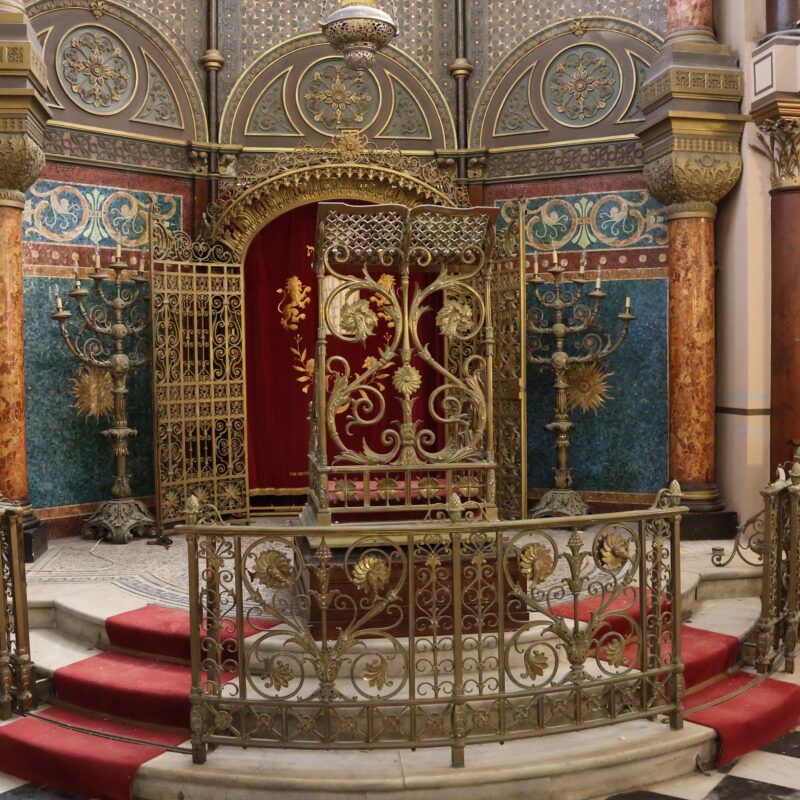 Photograph of the interior of grade II* Middle Street Synagogue in Brighton, showing ornate decoration.