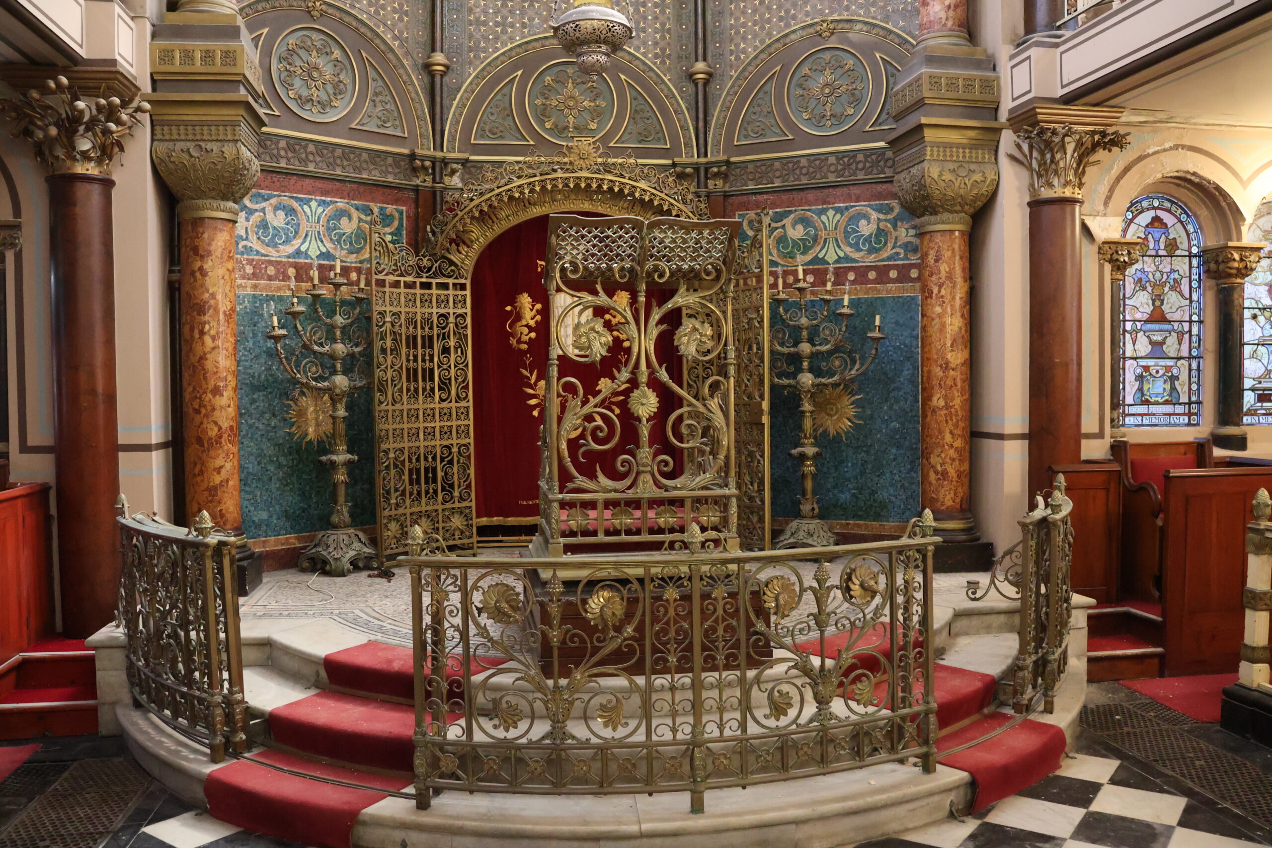 Photograph of the interior of grade II* Middle Street Synagogue in Brighton, showing ornate decoration.