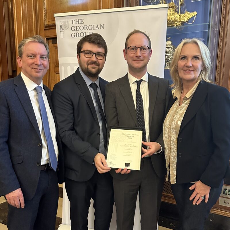 Pictured at the Georgian Group Architectural Awards 2024 ceremony: David Trevis-Smith, WWPT’s Project Manager, architects Dorian Proudfoot and Daniel Elkington, Donald Insall Associates; WWPT’s CEO Sarah McLeod OBE. The are smartly dressed and smiling at the camera.