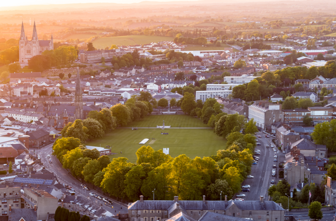 An aerial view of a park in the centre of a town