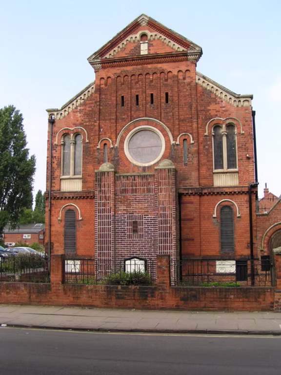 A photograph of a red brick building.