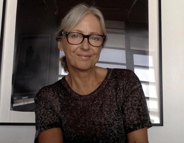 Head and shoulders photo of Laurie Peak. She wears glasses and smiles at the camera.