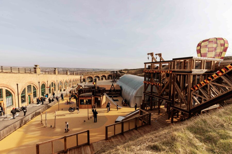 Photograph of Newhaven Fort, with an elaborate playground in the foreground.
